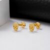 Aretes calavera en oro laminado 18K Piangere modernos