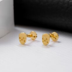 Aretes calavera en oro laminado 18K Piangere modernos