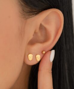 Aretes calavera en oro laminado 18K Piangere modernos