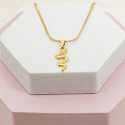 Dije serpiente con cristal en oro laminado 18K Piangere elegante