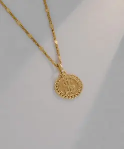 Dije signo peso en oro laminado 18K Piangere moderno